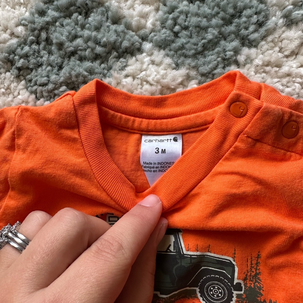 Orange carhartt baby onsie